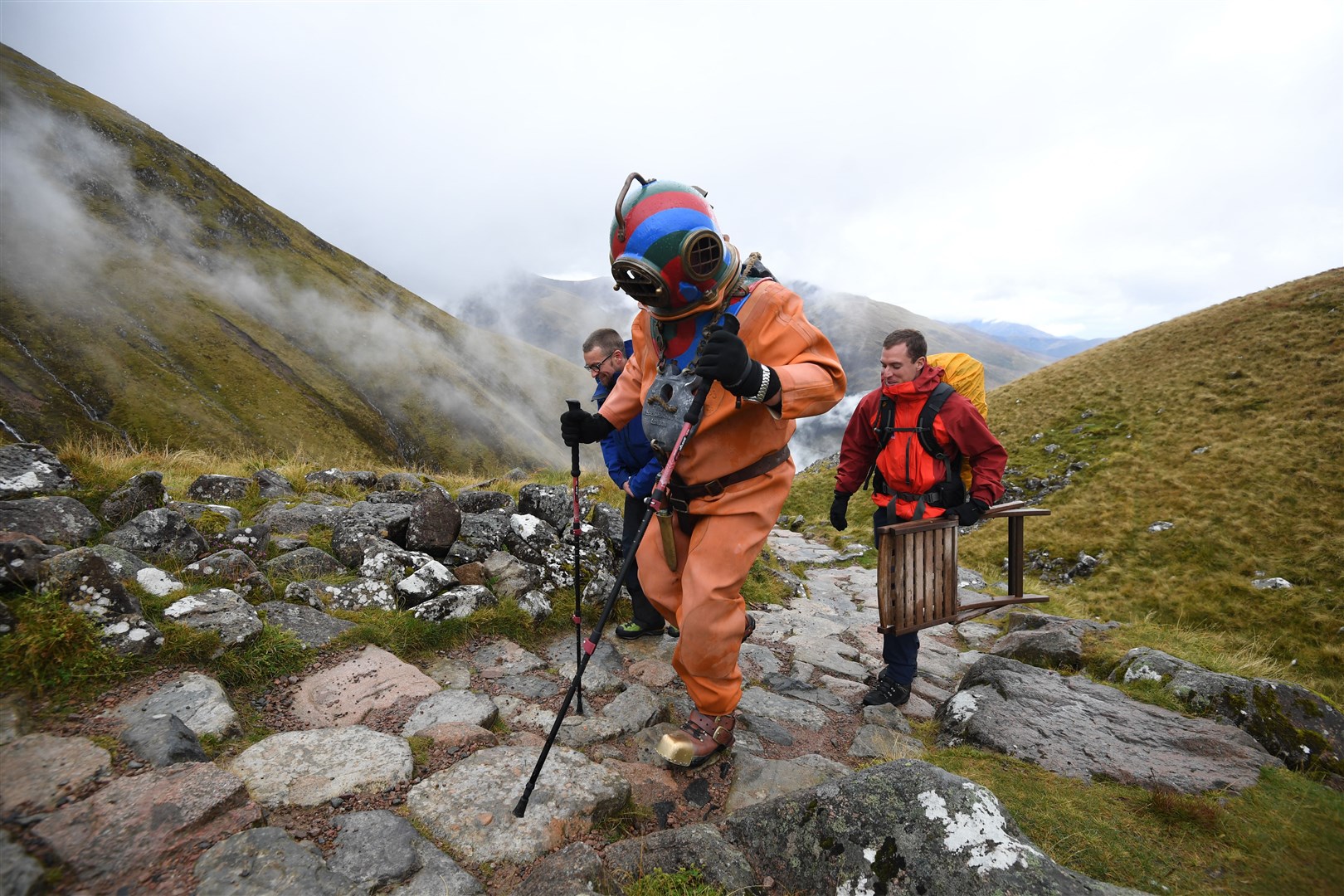 Veteran fundraiser Lloyd Scott is attempting to climb the Three Peaks while wearing a deep-sea diving suit (Joe Giddens/PA)