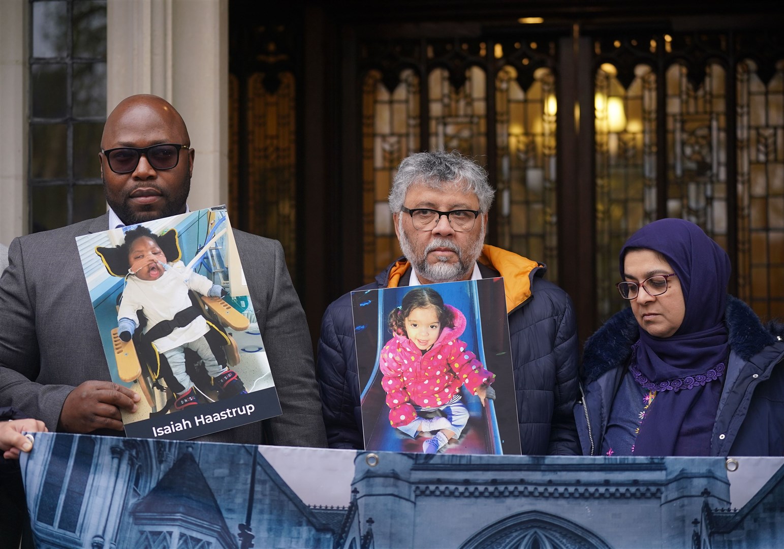 From left, Lanre Haastrup, father of Isaiah Haastrup, and Rashid and Aliya Abbasi, the parents of Zainab Abbasi, outside the Supreme Court (PA)