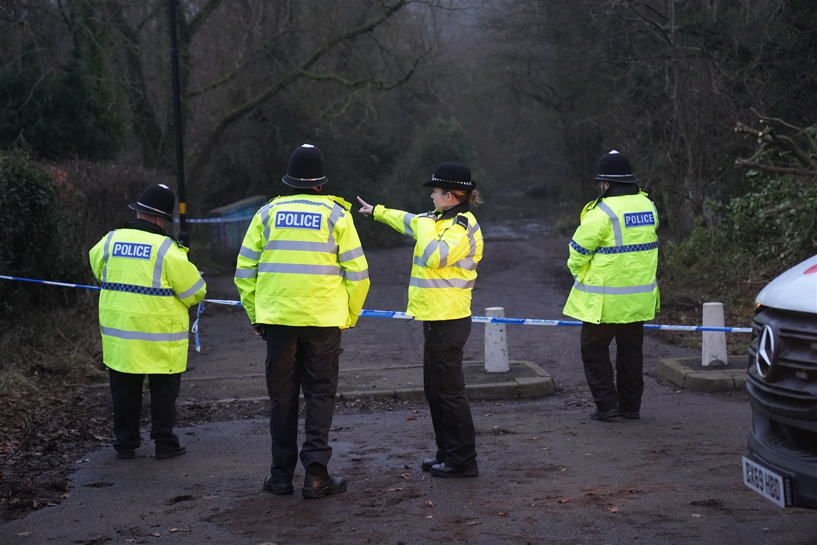 Police officers at the scene a day after Leo Ross’s death (Jacob King/PA)