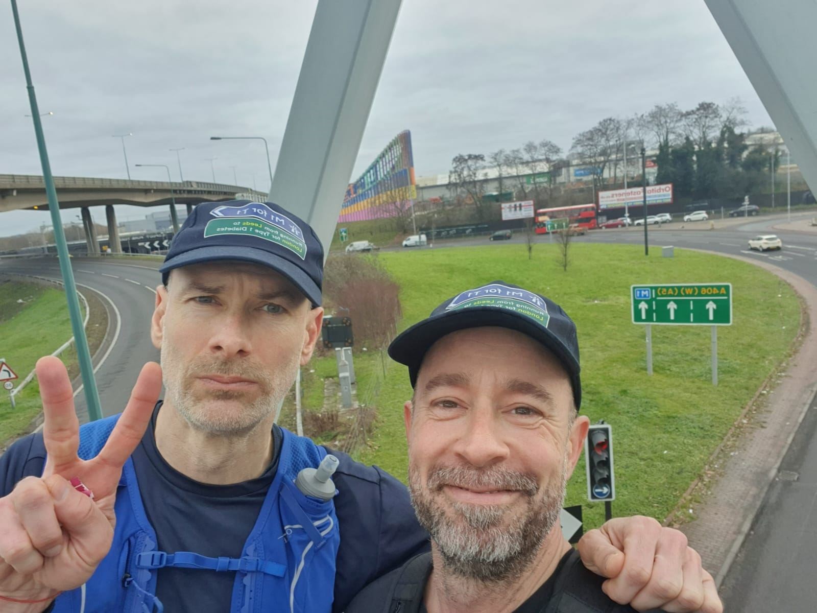 Jamie Austin with Thomas Rohde, one of his running partners, at junction one of the M1 (Thomas Rohde)