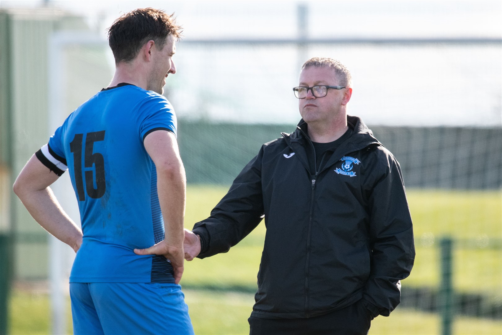 Charlie Brown chats to Strathspey Thistle captain James McShane. Picture: Daniel Forsyth.