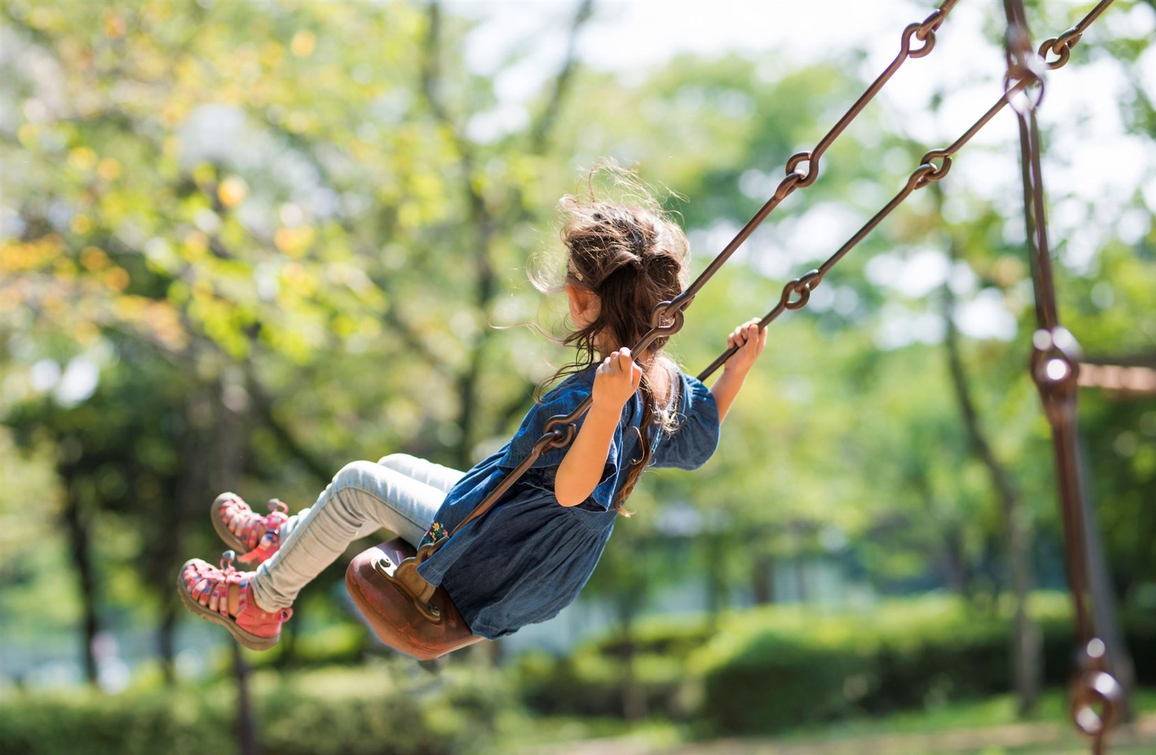 Little girl is playing with swing. Picture: iStock/Hakase_