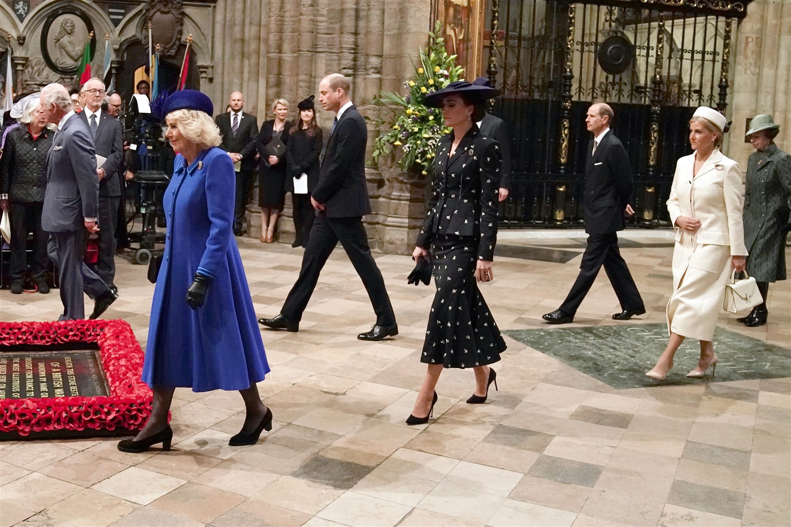 Members of the royal family walk around the grave of the unknown warrior as they take their seats for the 2023 Commonwealth Day service at Westminster Abbey (Jordan Pettitt/PA)