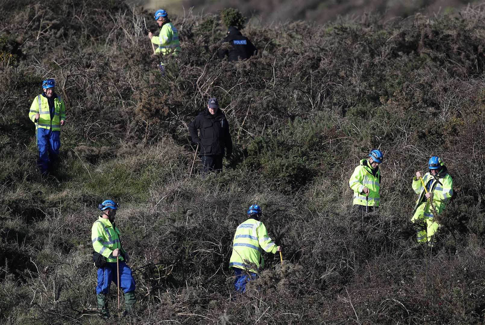 Police perform a fingertip search in the open space above the coast near to Swanage in Dorset by officers investigating the disappearance of Gaia Pope (Andrew Matthews/PA)