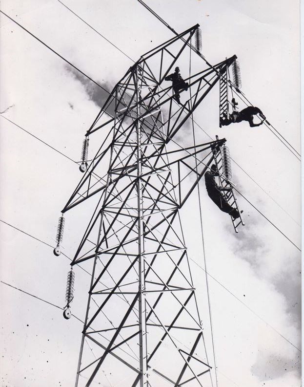 SSE Heritage archive photograph of workers on a 132kV line on the north of Scotland transmission network in the 1960s.