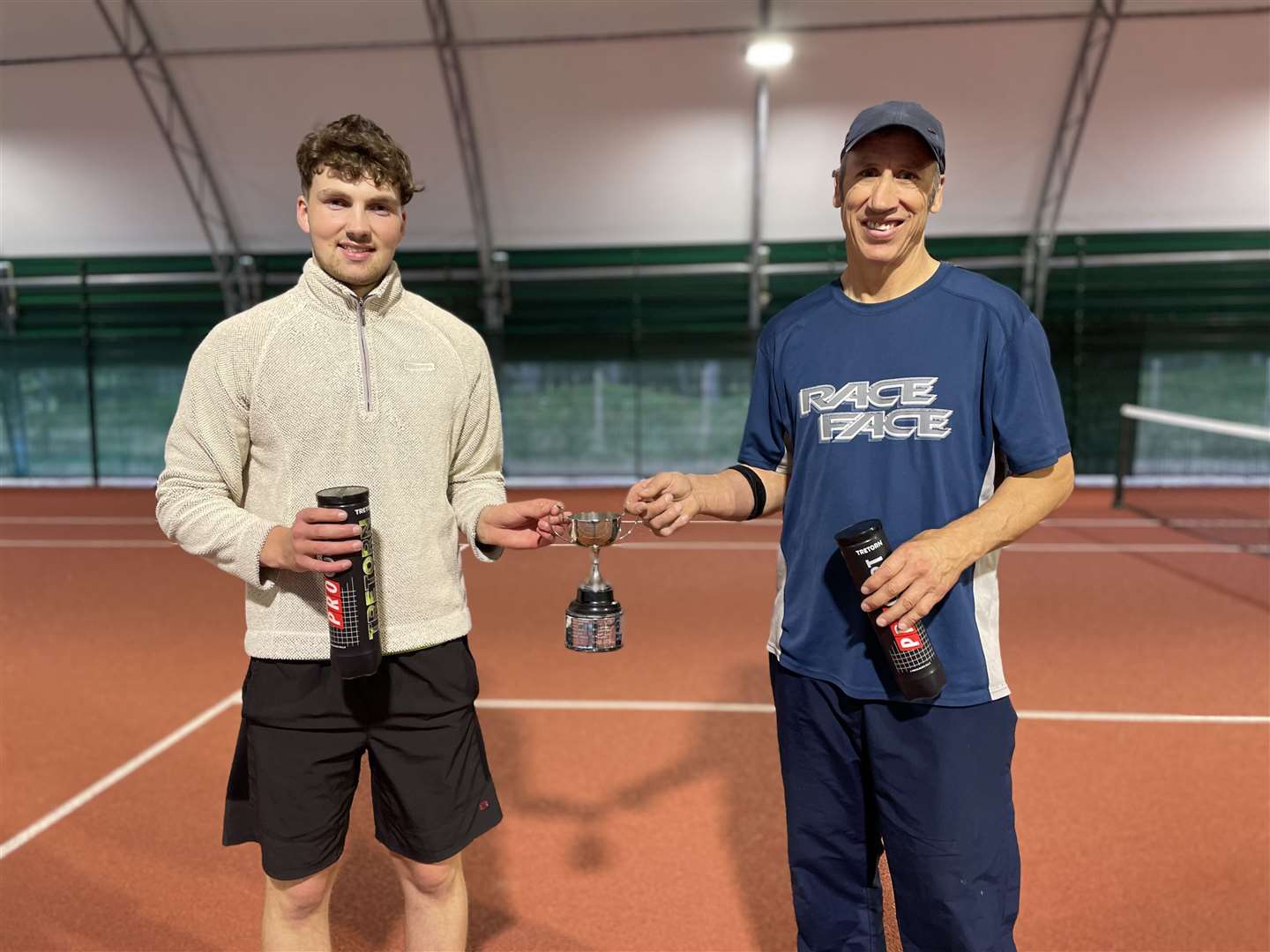 Men’s doubles winners Angus Harrold and Grant Davis with the trophy after winning in a tie-break.