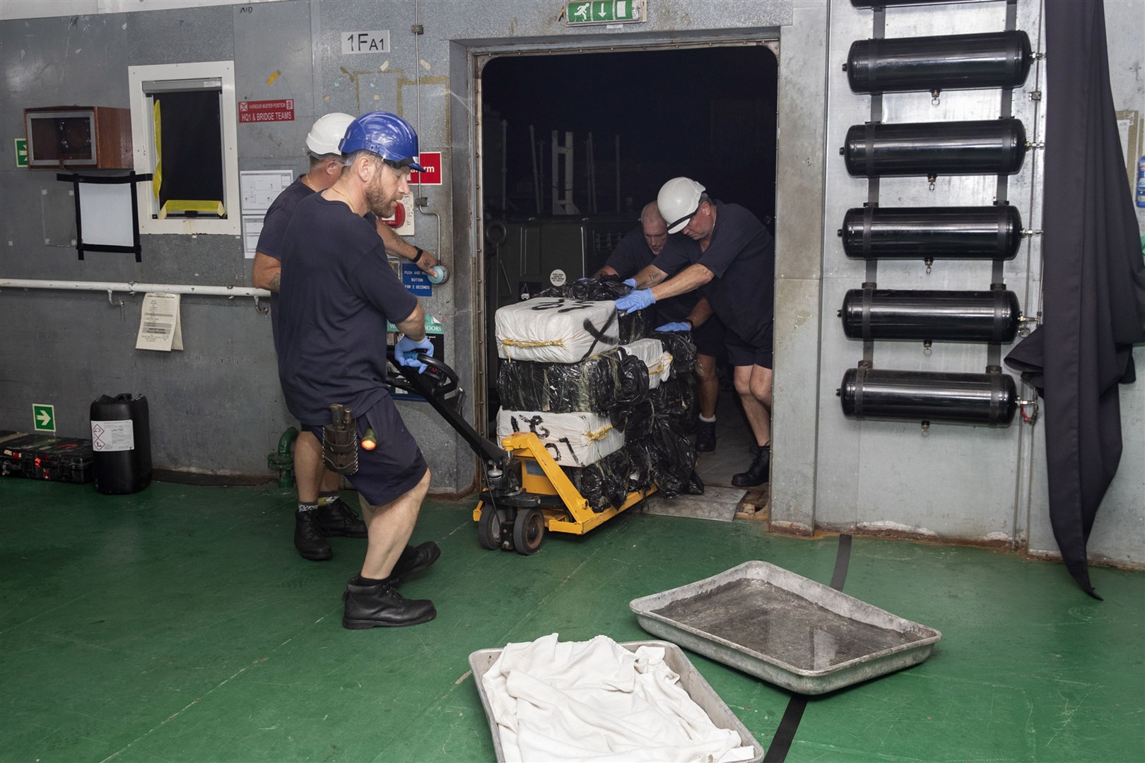 Suspected drugs being loaded onto support ship RFA Argus in the Caribbean Sea (Royal Navy/MoD/Crown Copyright/Joe Cater/PA)