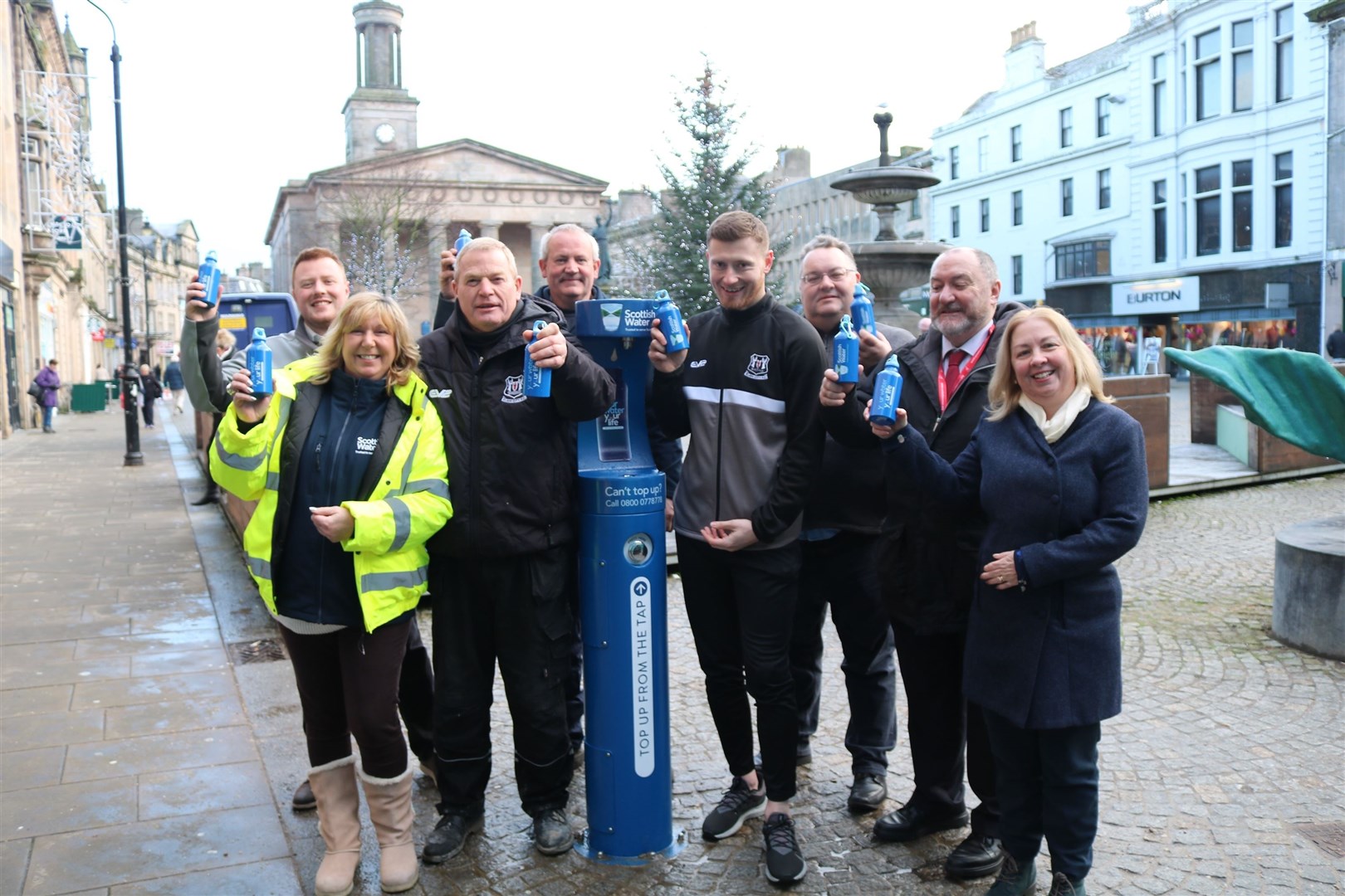 Raising a reusable bottle to Elgin's Top Up Tap.