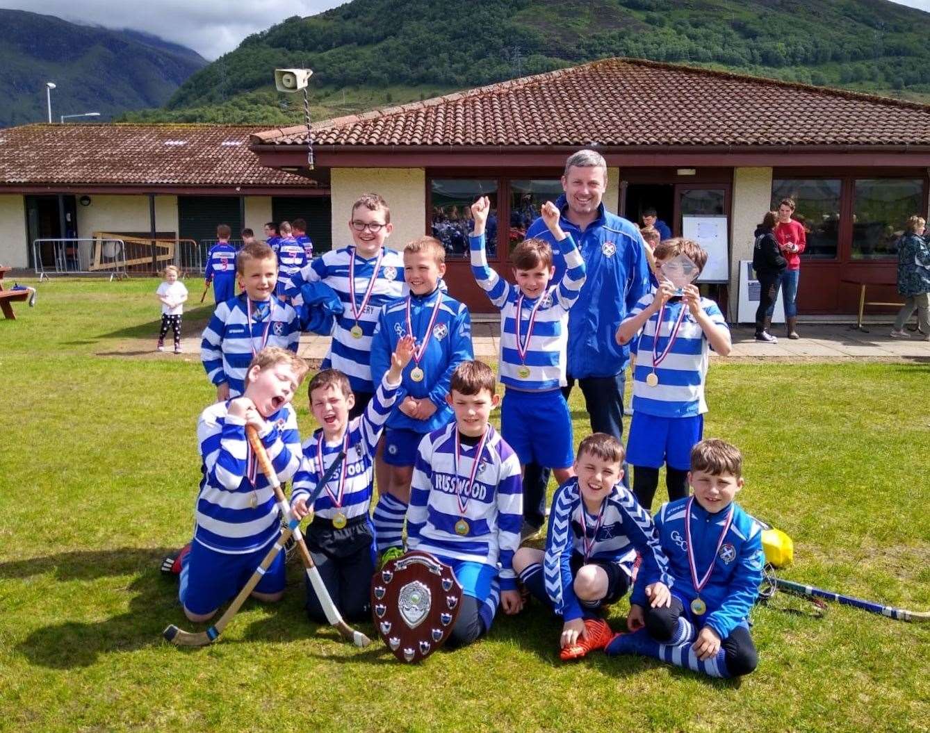 P5 and unders winners Newtonmore with coach Fraser Coyle.