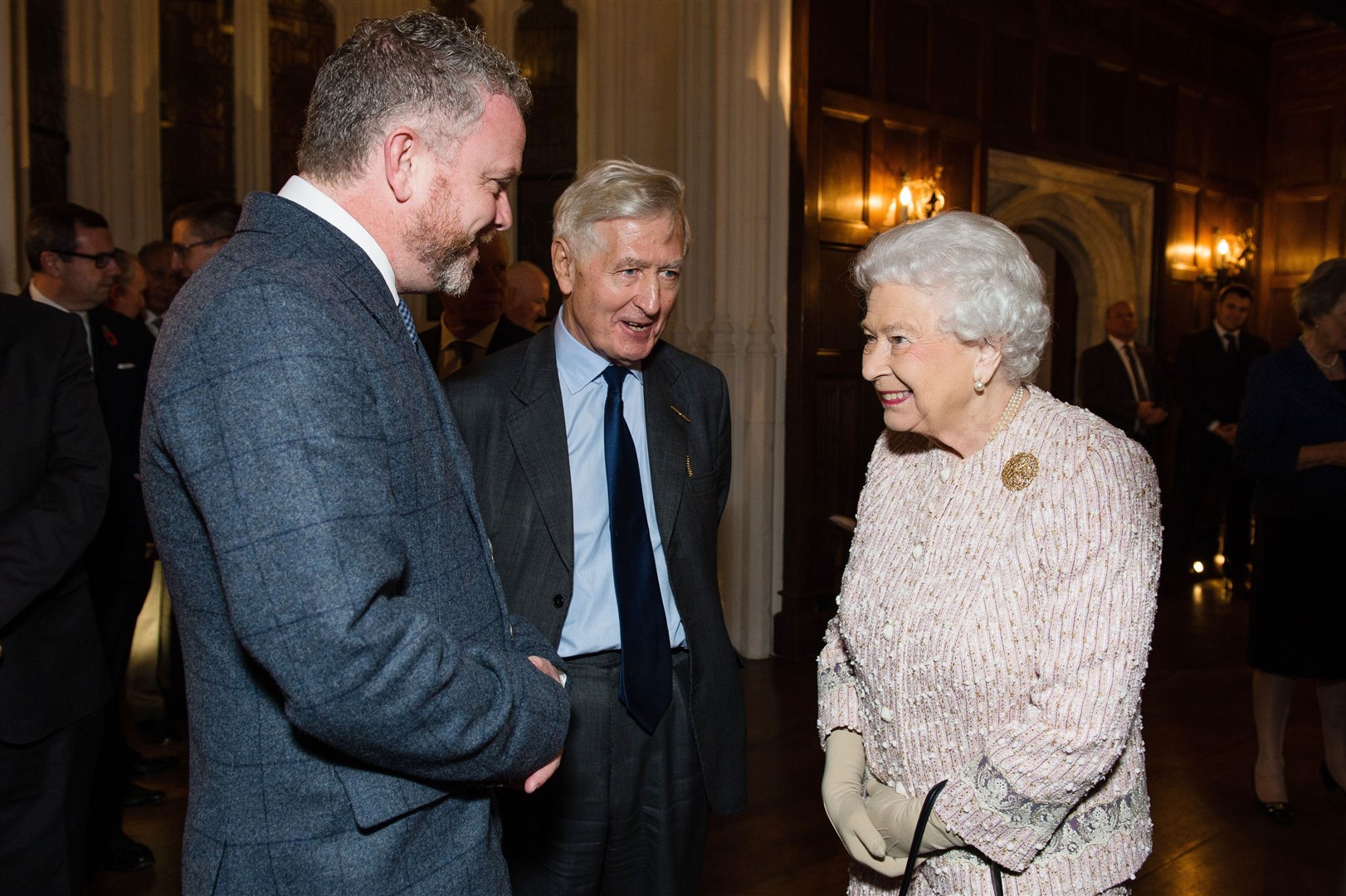 Colin Davidson with Dr Christopher Moran, chairman of Co-operation Ireland, and the Queen (Jeff Spicer/PA)