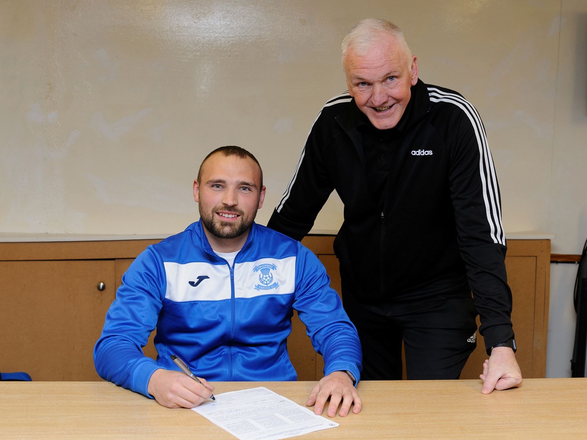 One of the new arrivals Josh Race with Jags manager Bobby Beckwith. Picture: Stewart Grant.