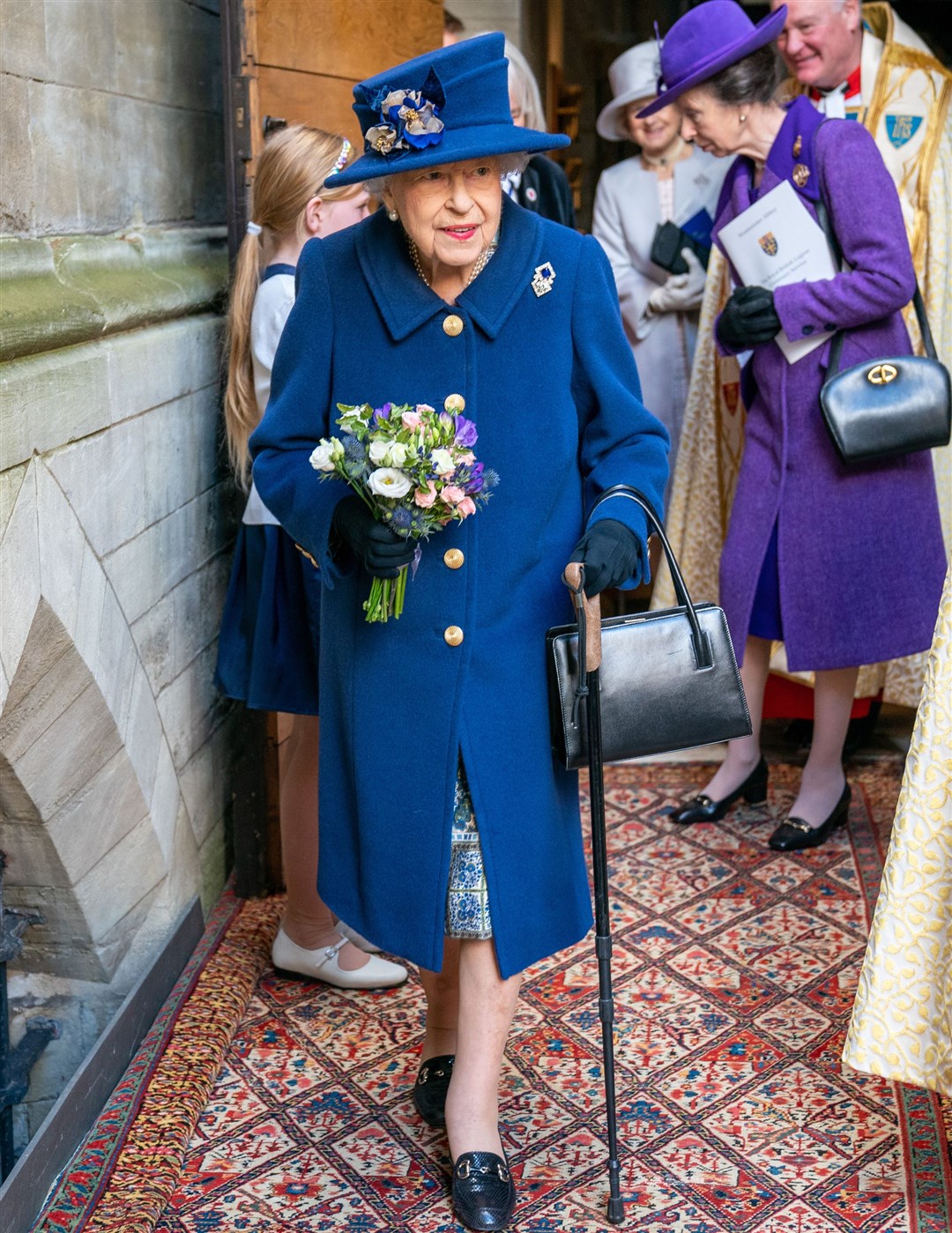 The Queen using a walking stick at Westminster Abbey (Arthur Edwards/The Sun/PA)