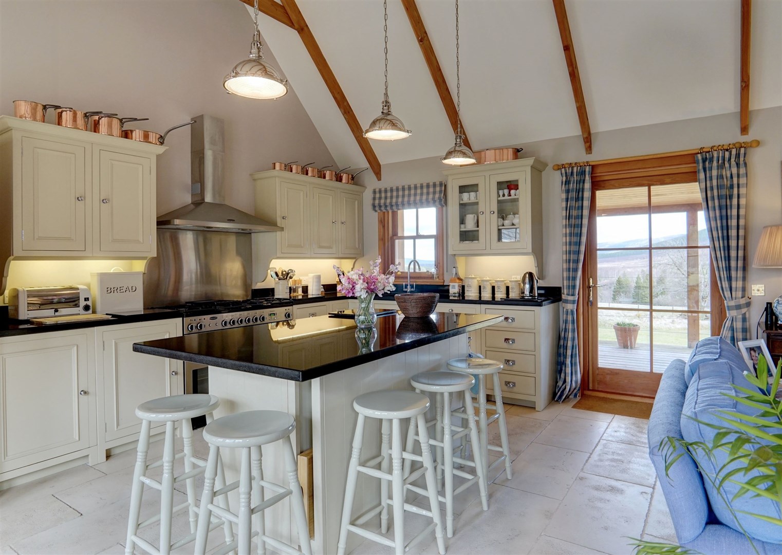 The kitchen and its island have a white theme.