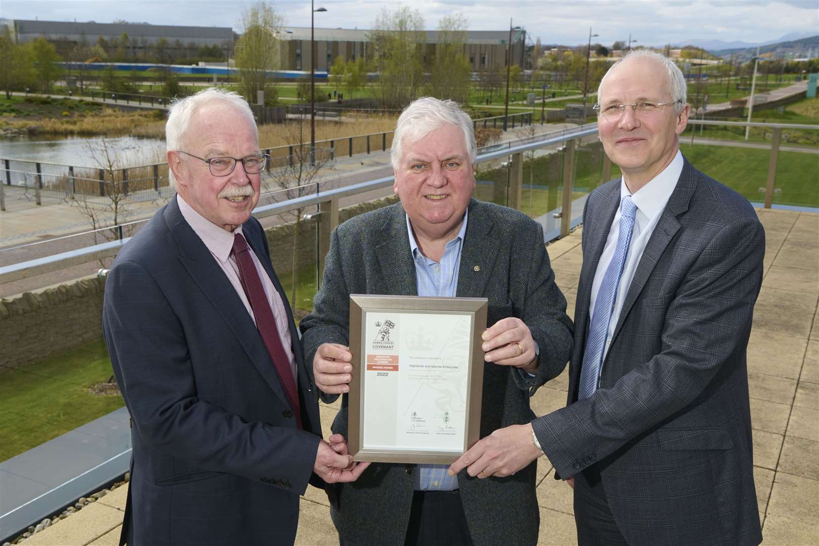 Roy McLellan, regional employer engagement director of the Highland Reserve Forces and Cadets Association (centre), presents the Bronze Award certificate to HIE chairman Alistair Dodds ((left) and HIE chief executive Stuart Black.