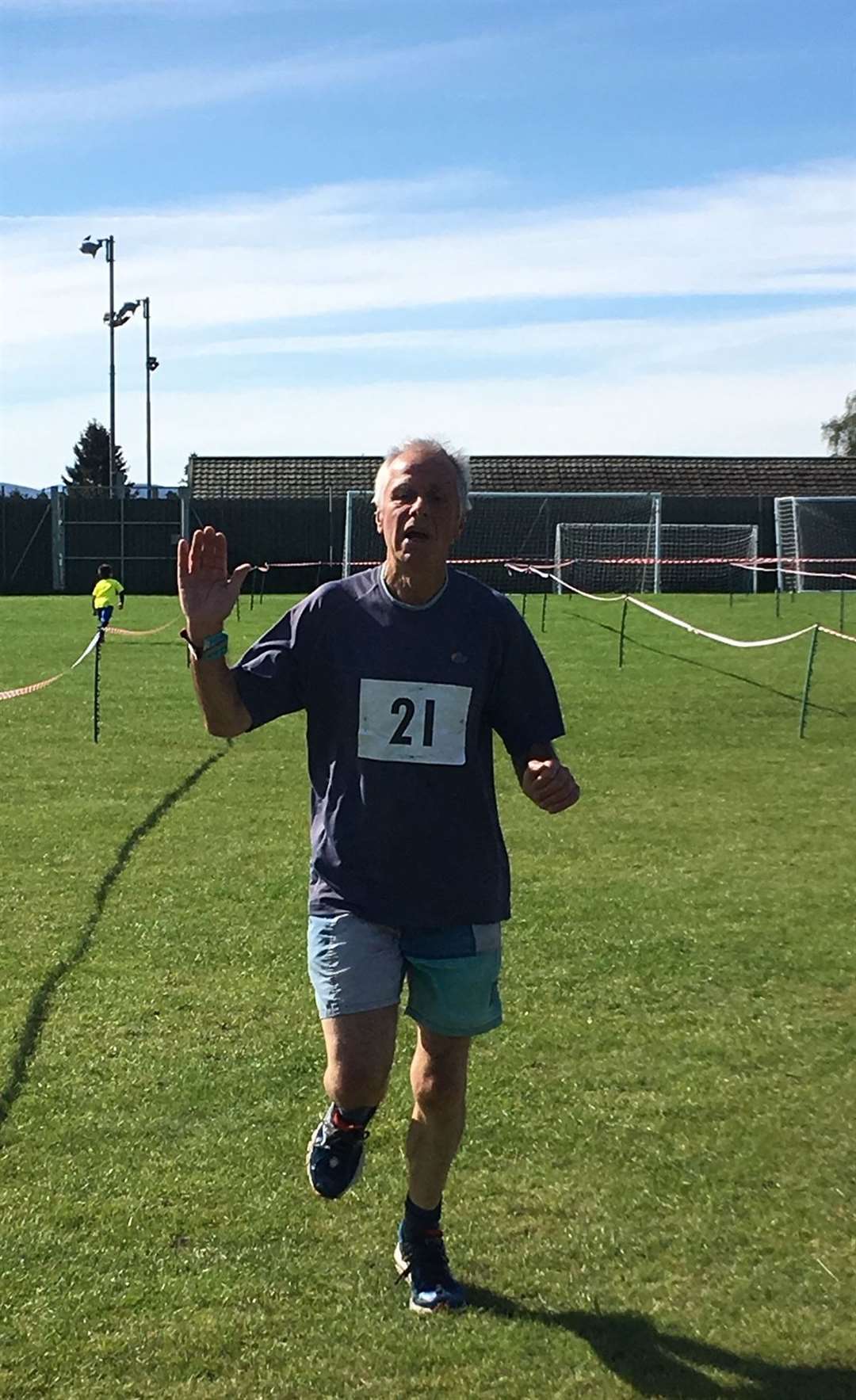 Pete Moore crosses the finish line to claim the vintage men's title.