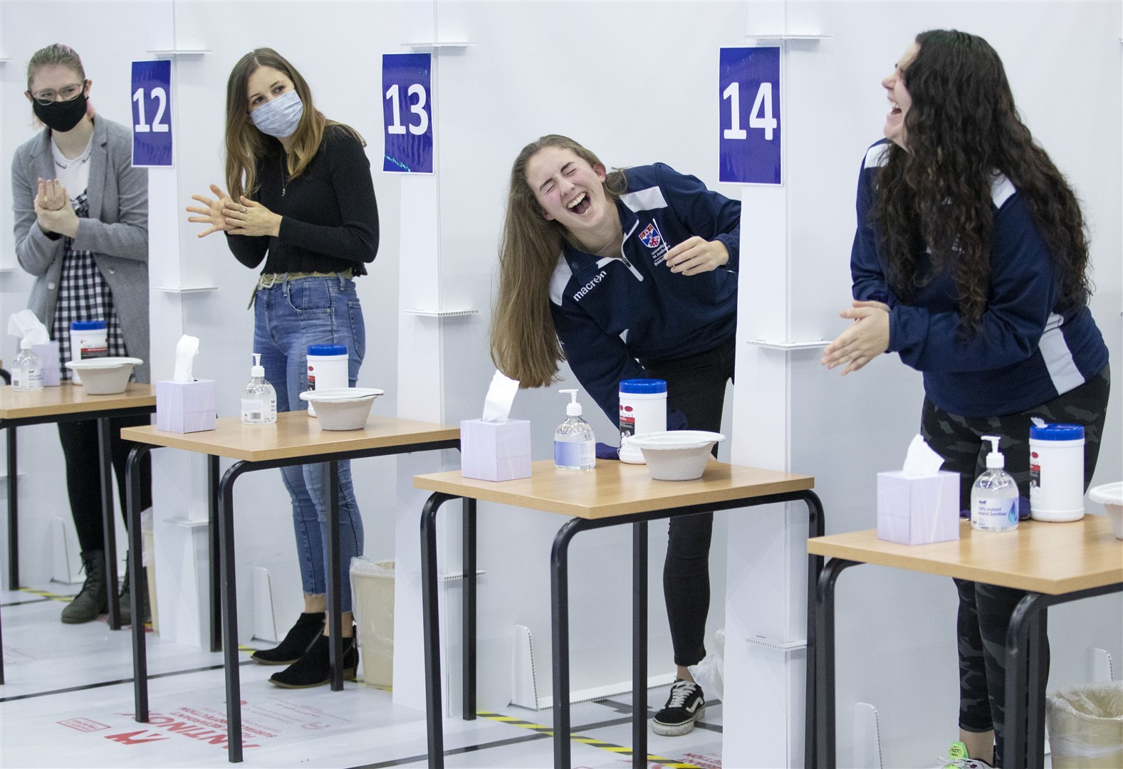Students get a Covid-19 test at a mass testing centre set up at the sports centre at St Andrews University, ahead of the Christmas holiday (Jane Barlow/PA)