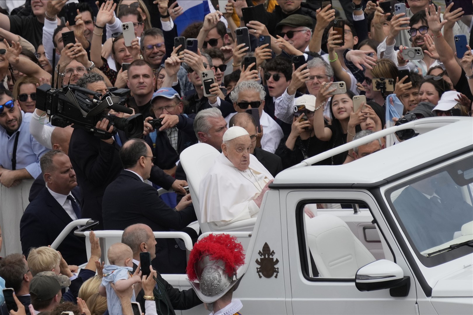 Pope Francis tours St Peter’s Square in his Popemobile on Easter Sunday (Gregorio Borgia/AP)