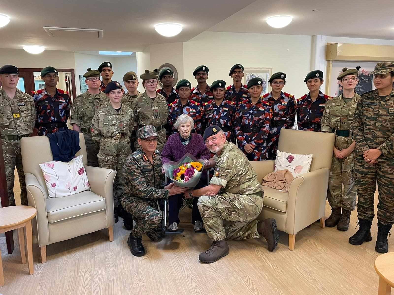 Thank you, Ma'am: the cadets at the Wades Centre with the special lady who cared so beautifully for their countrymen's graves in the New Cemetery.