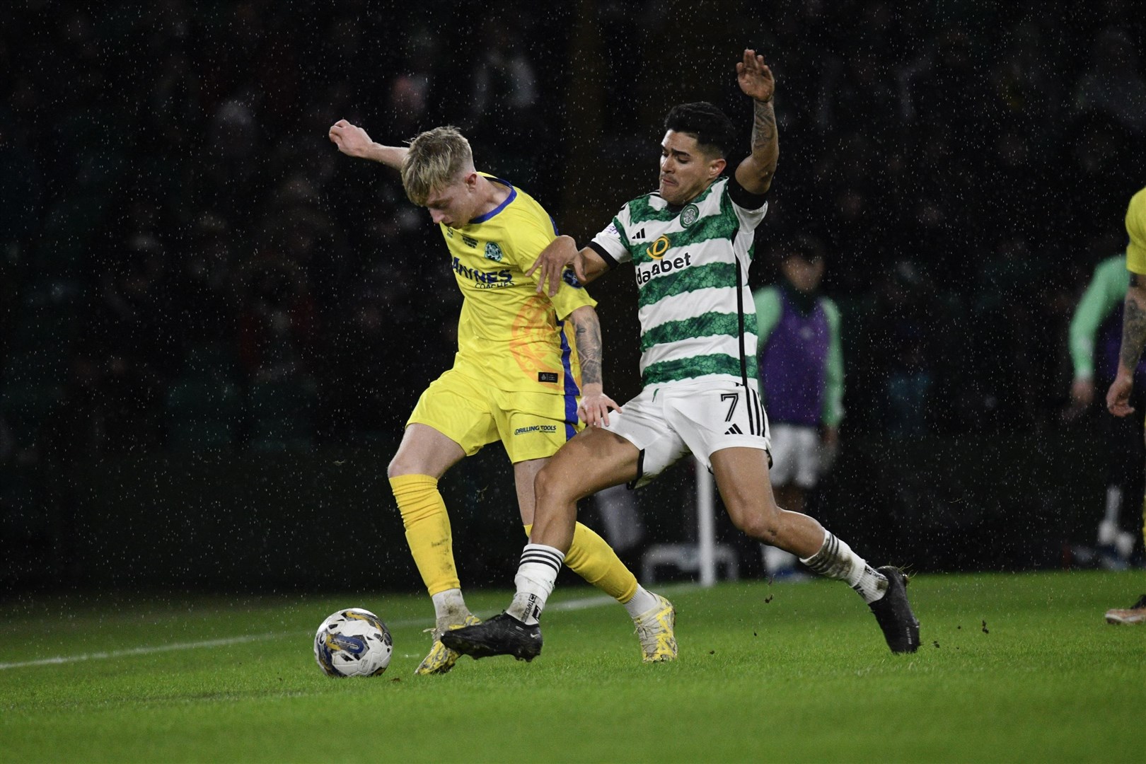 Buckie's Jack MacIver takes on Celtic's Luis Palma. Picture: Daniel Forsyth