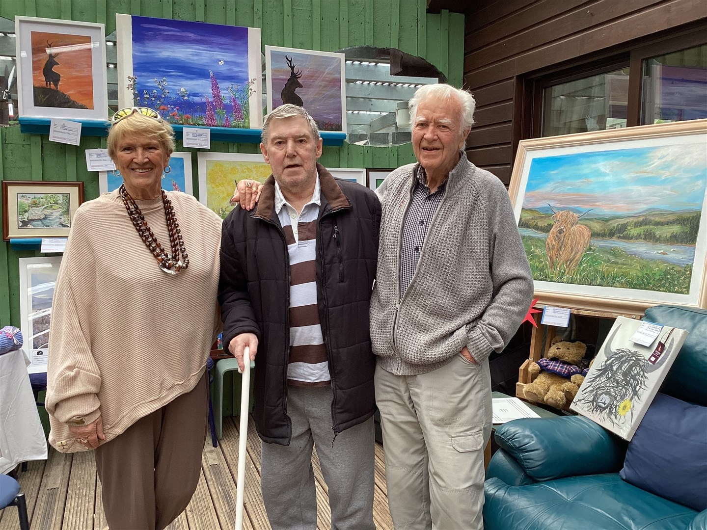 Mr Lambie (right) and his wife Betty pictured with visitor and well-wisher Donald Mackenzie at a fundraising pop-up gallery and art sale the couple organised at the Speyside Centre at the end of May. They were blown away by the response with nearly £5000 raised in total towards buying and installing a defibrillator and the rest going to the Wishing Well fund to support local causes. There was original local art work for sale, local crafters demonstrating jewellery-making, felting and card-making and a tombola.