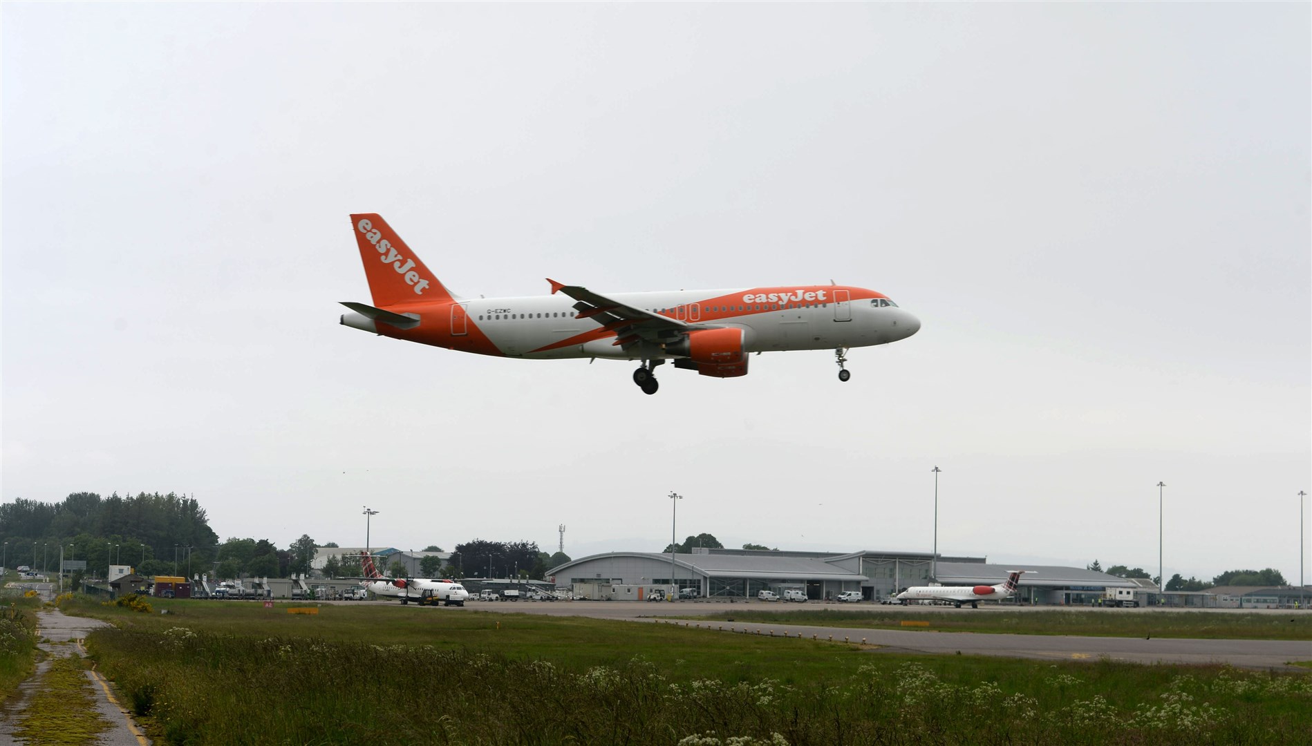 An EasyJet flight from Gatwick lands at Inverness Airport.
