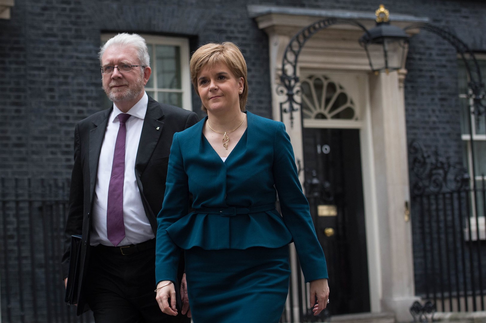 Leaving 10 Downing Street in London with her Brexit minister Michael Russell after a meeting with Theresa May in 2016 (Stefan Rousseau/PA)