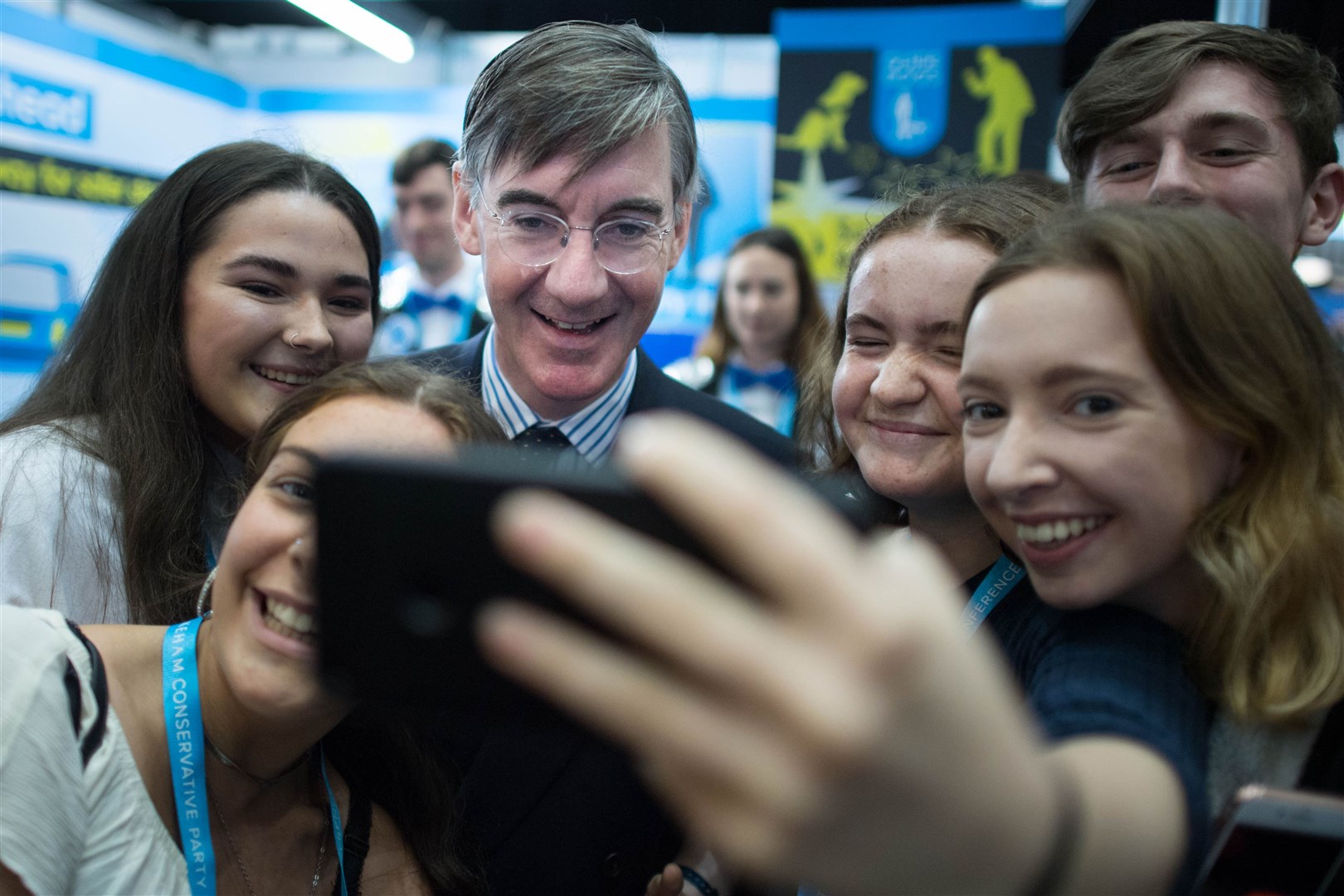 Jacob Rees-Mogg with young people during a Conservative Party Conference (Stefan Rousseau/PA)