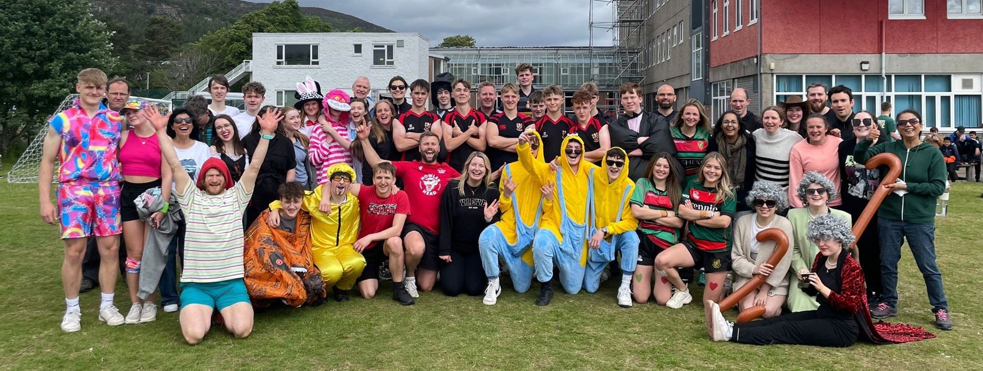 ONE LAST GROUP PHOTO: Departing pupils and staff at the traditional softball game.