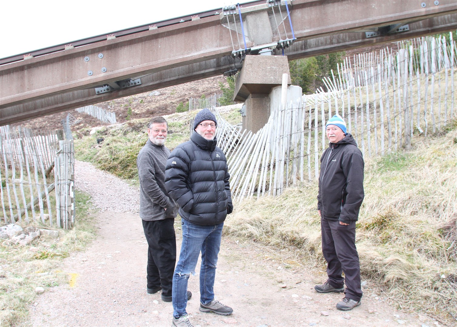Stuart MacAulay, Mike Marcus and John Talbot look over the scarf joints which have been at the heart of the problem keeping the funicular out of operation.