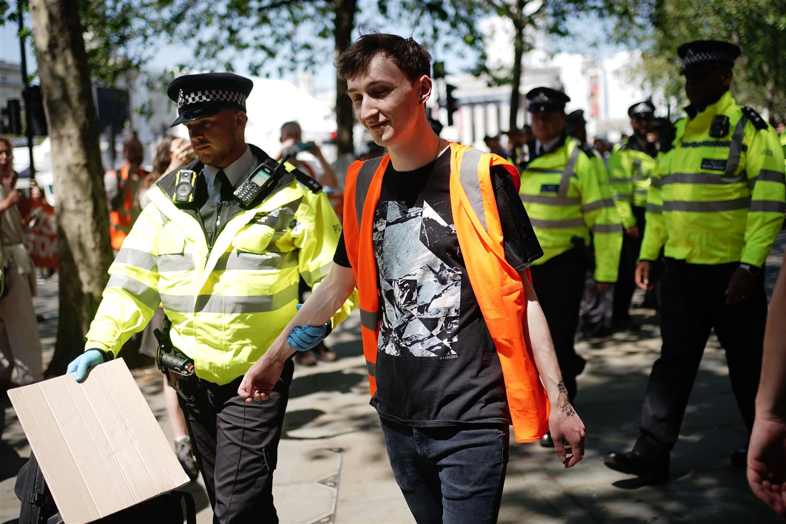 Police detain a Just Stop Oil activist during a protest by the environmental campaigners in central London (Aaron Chown/PA)