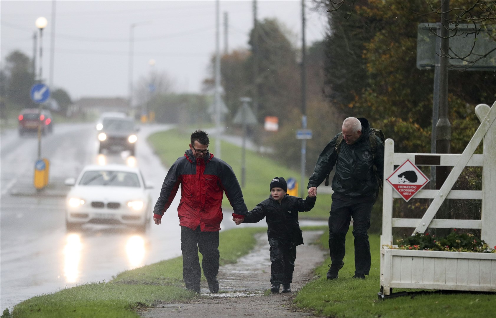 Jacob Newson (centre), on his seventh birthday, arrives with his dad Andrew (left) at the Battle of Britain Memorial in Folkestone (Andrew Matthews/PA)