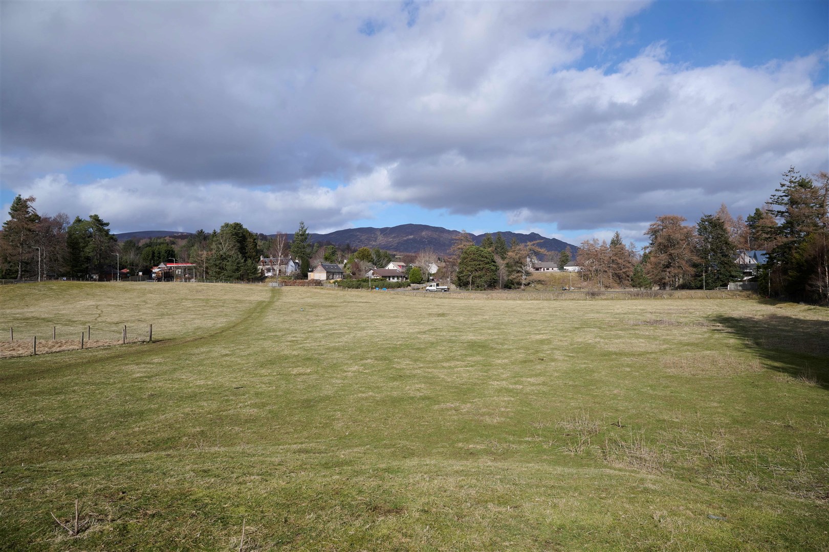 Think of a name! That's the challenge for the children of Newtonmore Primary School as they view the site of their village's new homes development.