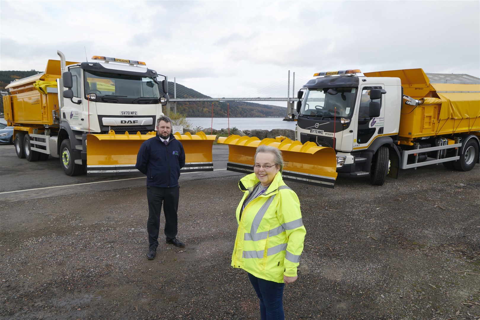 Highland councillor Trish Robertson and the local authority's transport and logistics manager Mike Cooper with two of the new snowploughs.