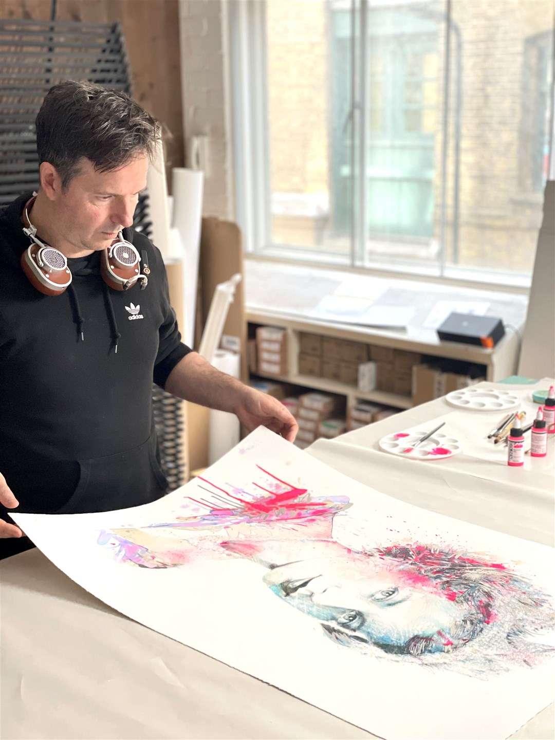 Carne Griffiths with his artwork – The Platinum Queen (West Contemporary Editions/PA)