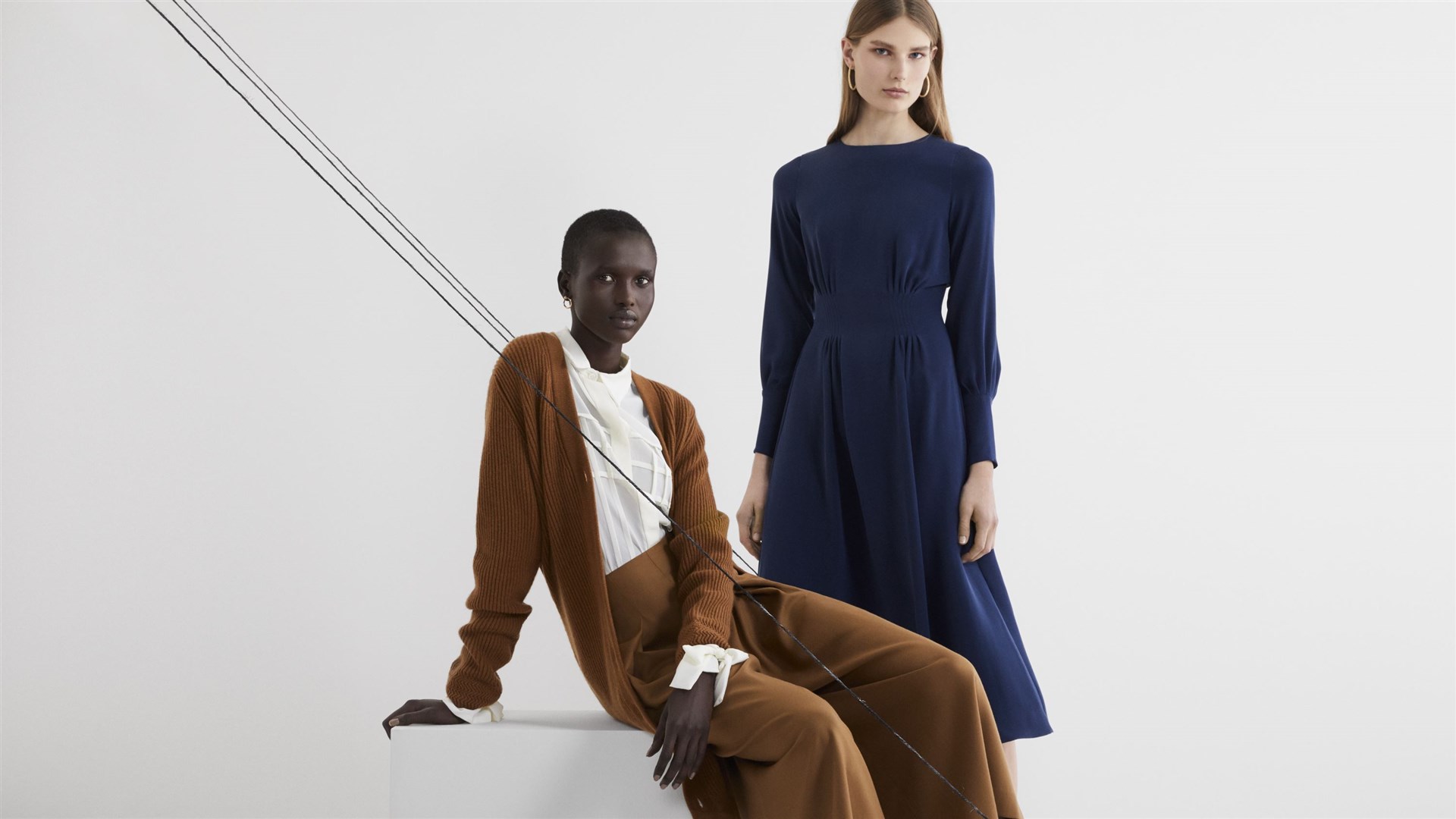 A belted cashmere cardigan, culottes and silk shirt, and silk midi dress (The Prince’s Foundation/PA)