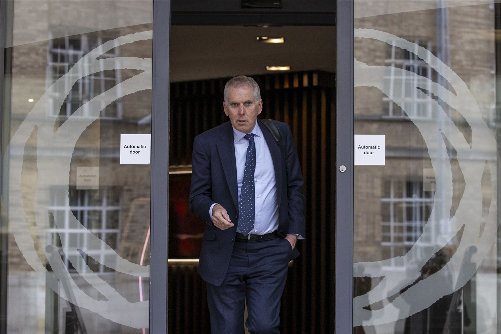 Sir David Sterling leaving the Clayton Hotel in Belfast after giving evidence at the UK Covid-19 inquiry hearing on Wednesday (PA)
