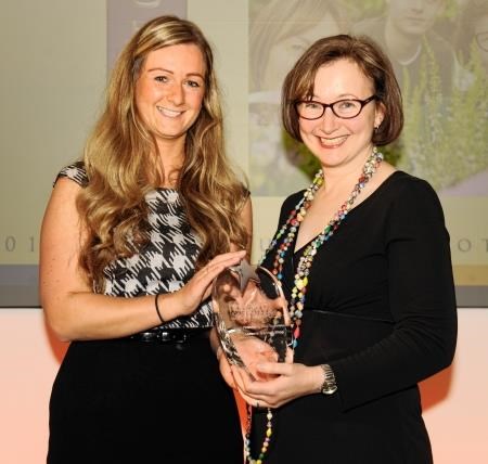 Iona Malcolm is presented with her award
