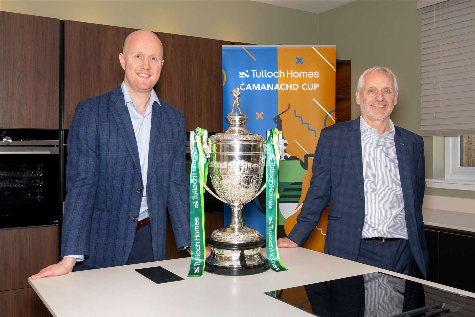 Kieran Graham, Tulloch Commercial director and Sandy Grant, Tulloch Homes managing director, with the Tulloch Homes Camanachd Cup. Picture: Neil G Paterson.