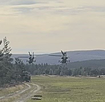 PARTNERS: Two Apaches hovering over the Cairngorm Gliding Club airfield today. Picture: E. Mackay