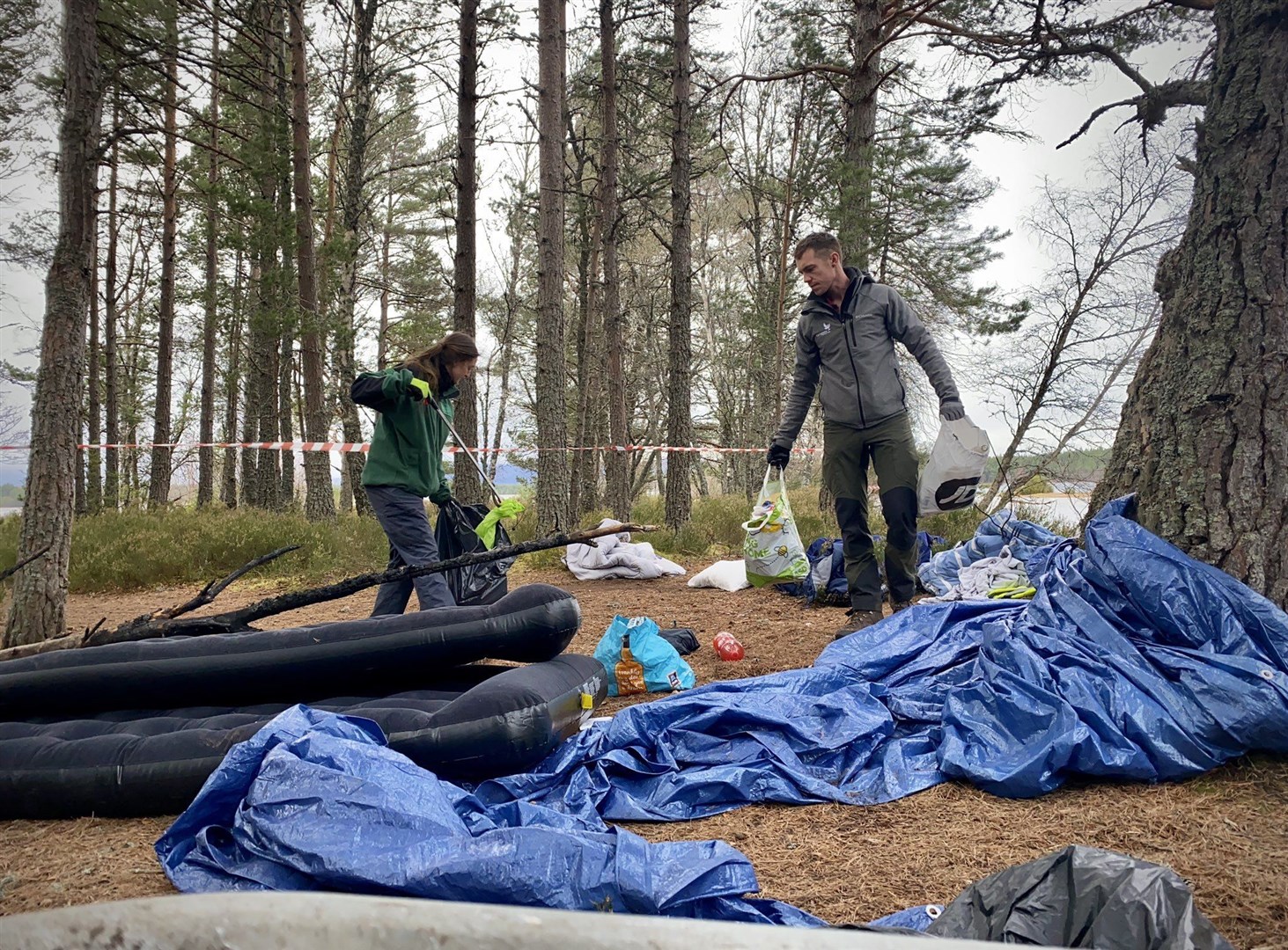 CNPA rangers get to work clearing the dirty campers' rubbish at Loch Morlich last year.