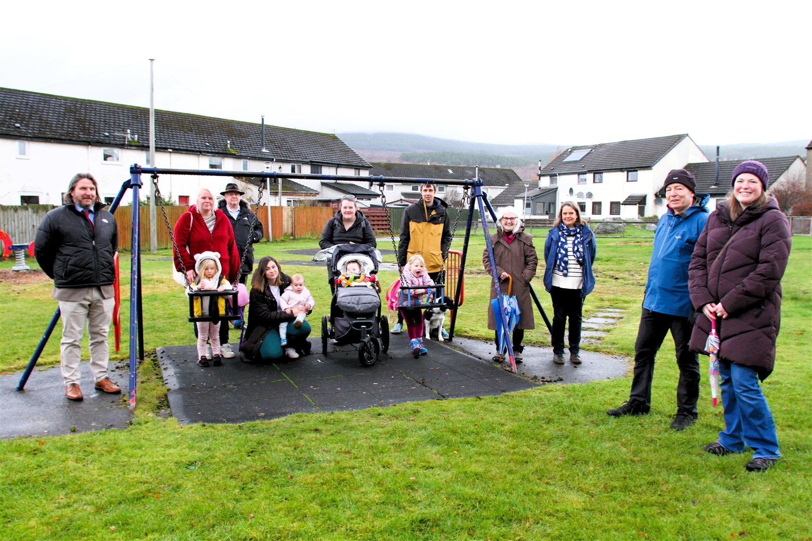 Katy Davies (right) with Aviemore Community Council chairman Peter Long, parents and tots, along with local councillors Russell Jones, Bill Lobban and Muriel Cockburn and Lynne MacGillivray (third right) inspecting Burnside playpark on Monday.