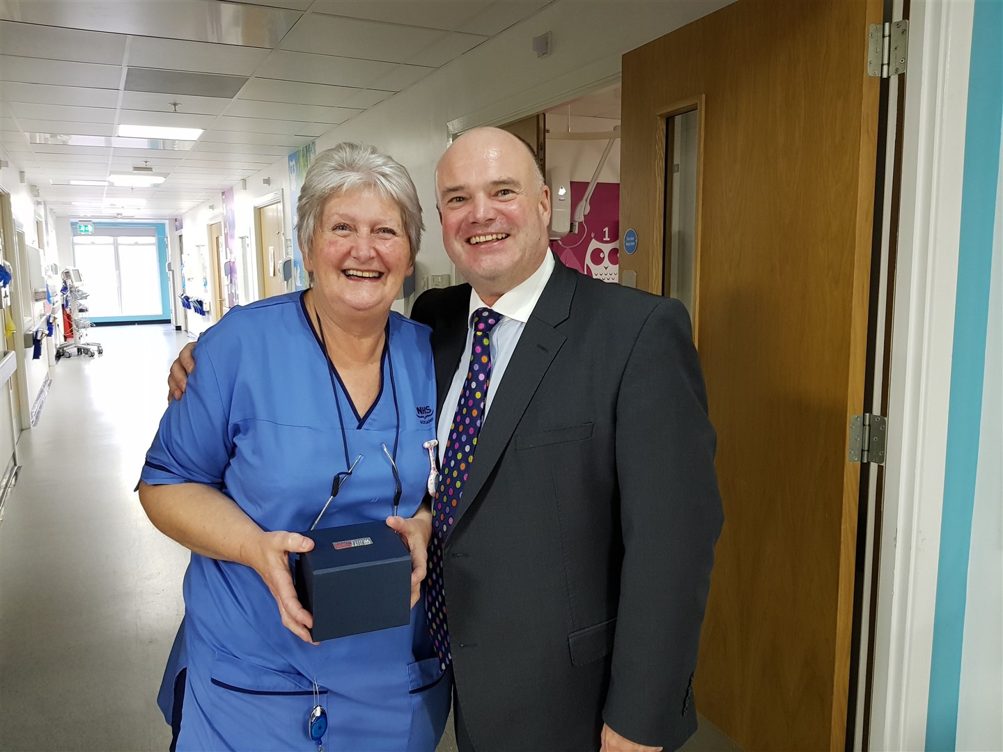 Sandie Macleod (left) accepting her Highland Quality Approach special merit award from Chief Executive Iain Stewart.