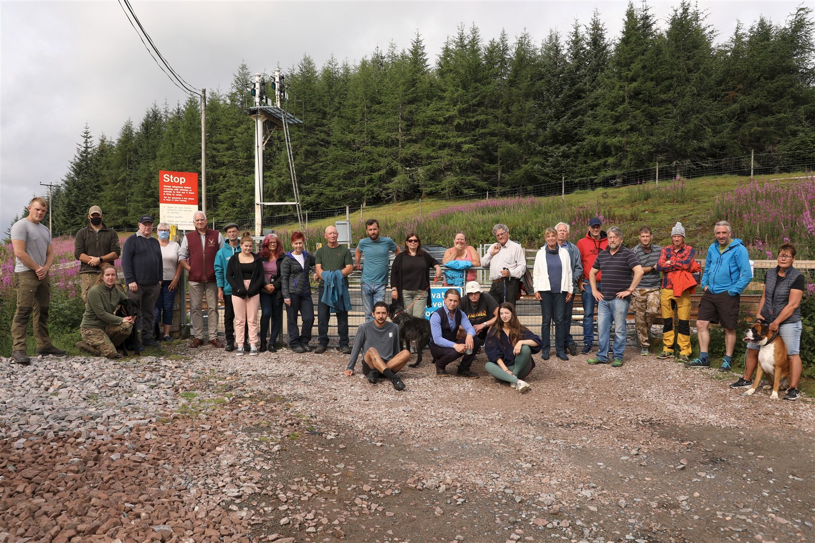 MAKING THEIR POINT: Campaigners at the level crossing at the end of Ben Alder road yesterday morning ahead of its closure.