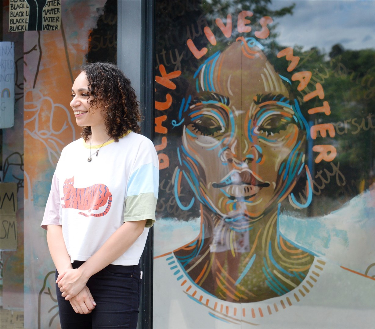 Artist Jacqueline Briggs with her specially-commissioned artwork. Picture: Gary Anthony