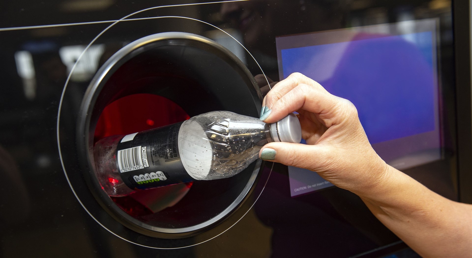 A reverse vending machine in operation.