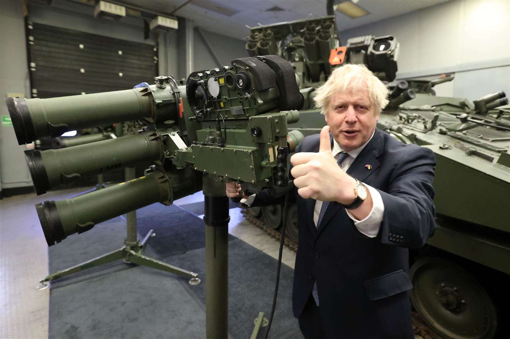 Boris Johnson with a Mark 3 shoulder launch LML missile system, at Thales weapons manufacturer in Belfast (Liam McBurney/PA)