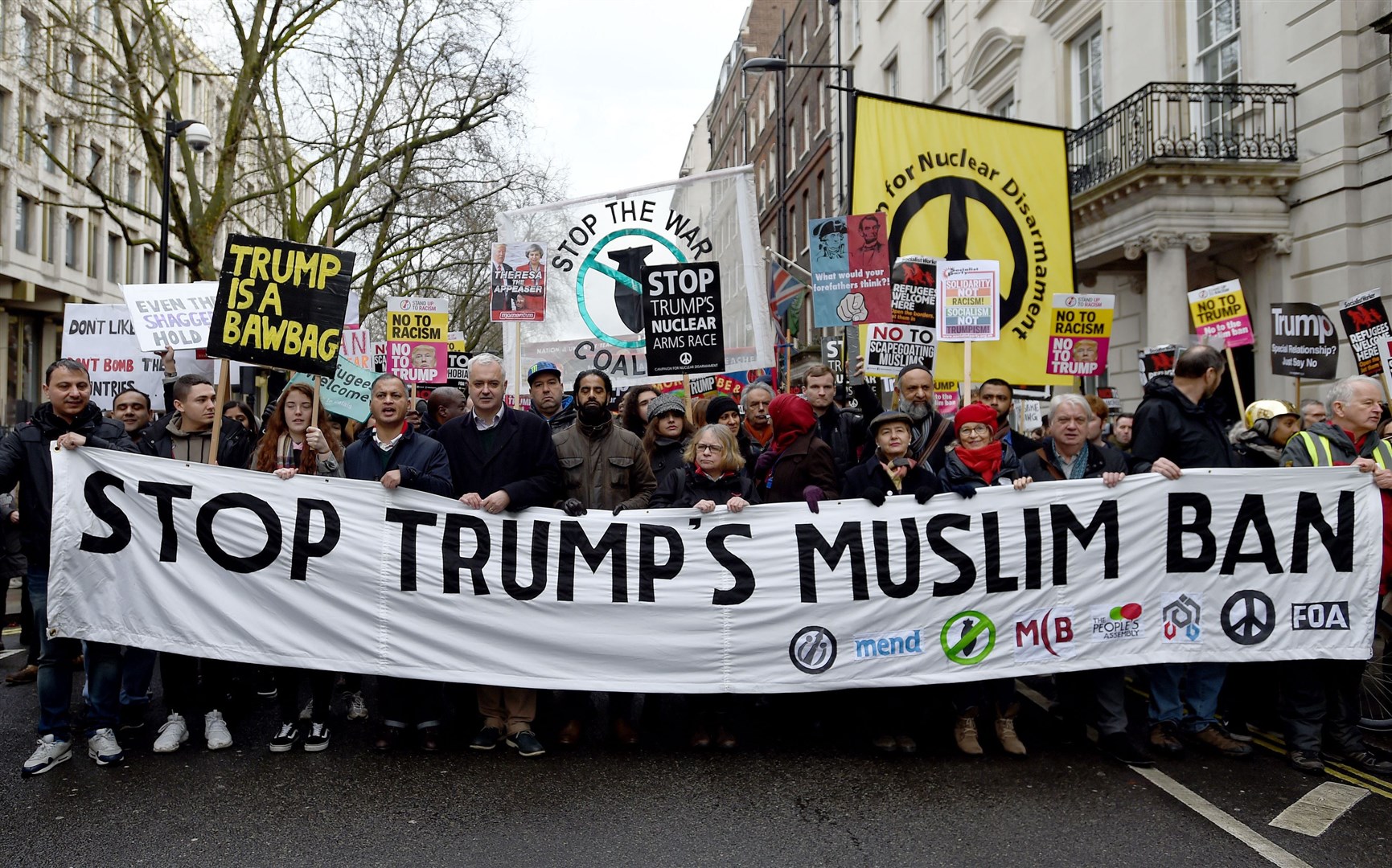 Demonstrators march to Downing Street, as they protest against US President Donald Trump’s travel ban(David Mirzoeff/PA)