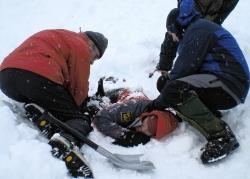 Johan Jones is uncovered by our group of rescuers after 'volunteering' to act as our casualty buried under the snow.