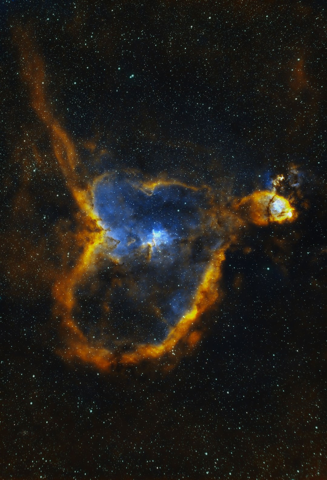 Further out again we find two nebulae in the constellation, Cassiopeia.Graham said: "The first is the Heart Nebula and is one of the most beautiful nebulae that I have had the pleasure to image. The Heart Nebula is some 7,500 light years from earth and is in the Perseus Arm of our Milky Way Galaxy. "In this narrowband image the blue colour is ionised oxygen and the orange colours from ionised sulphur gases."