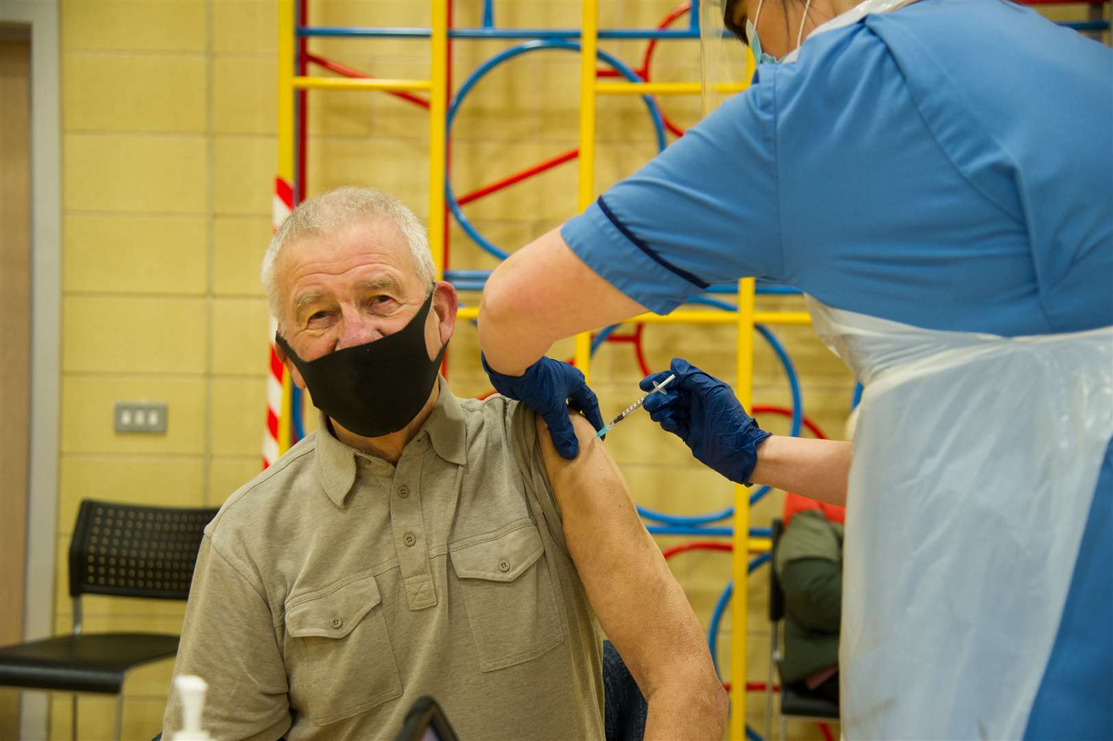 A man receiving a vaccination for Covid-19. Picture: Becky Saunderson.